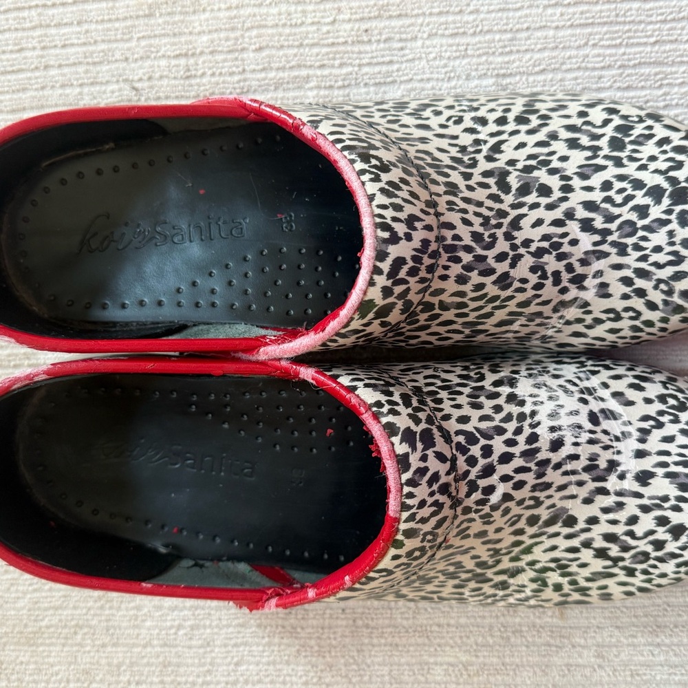 Sanita Black and White Clogs with Red Trim